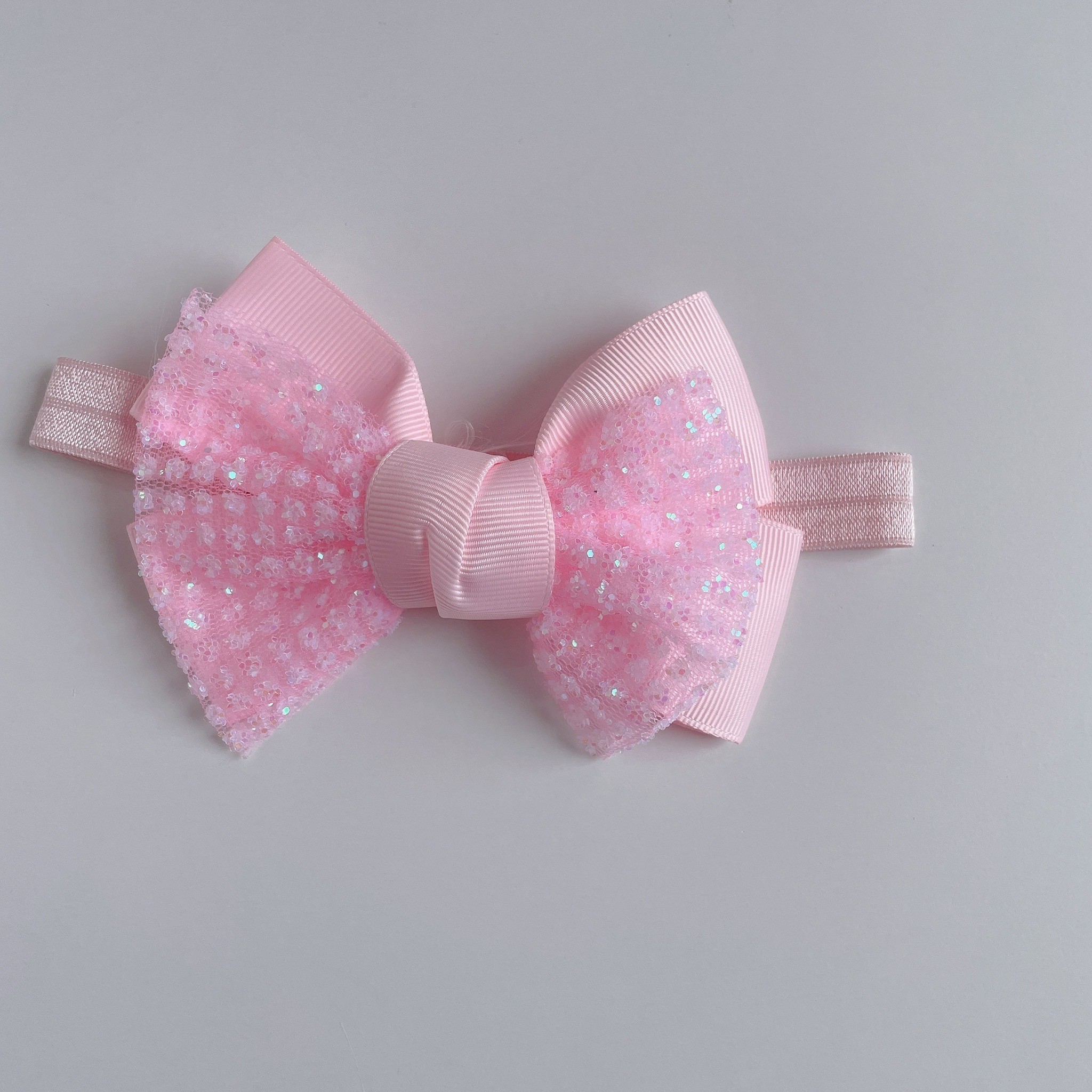 ピンクキラキラリボンヘアバンド